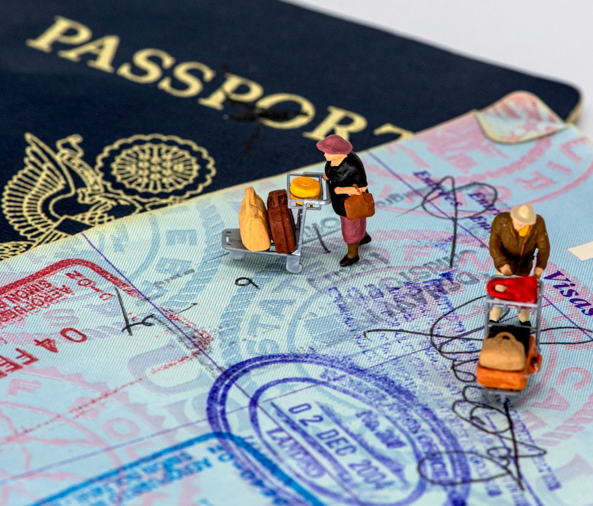 Australian passport and visa application documents representing the Assurance of Support requirement for parent visas