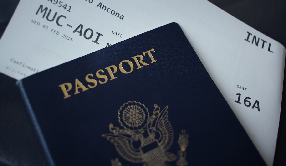 Passport and travel documents on a table representing the renewal process for the subclass 870 Sponsored Parent Visa