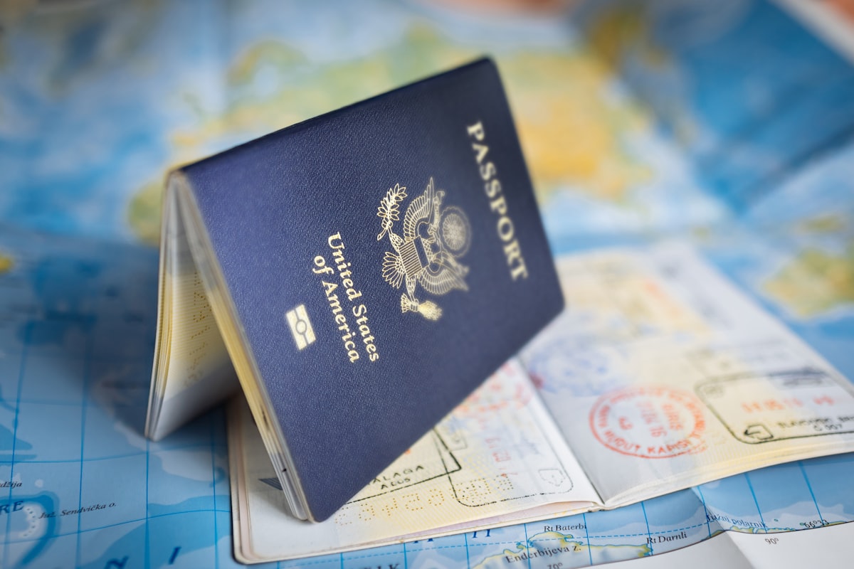 Passport and travel bag representing what to do during the long waiting period after lodging an Australian parent visa application